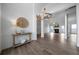 Open-concept living room with lots of natural light, wood-look floors, and a fireplace at 3047 Standing Rock Ct, Lithia Springs, GA 30122