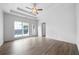 Spacious main bedroom with ceiling fan, tray ceilings, and lots of natural light at 3047 Standing Rock Ct, Lithia Springs, GA 30122