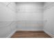 Walk-in closet with wire shelving and wood floor at 3047 Standing Rock Ct, Lithia Springs, GA 30122