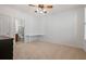 Neutral bedroom featuring a ceiling fan, an attached bathroom, and built in desk area at 4305 Kendall Way, Roswell, GA 30075