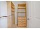 Walk in closet with wood shelving and drawers for optimized organization and storage space at 4305 Kendall Way, Roswell, GA 30075