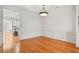 Formal dining room featuring wood floors, wainscoting, and chandelier at 4305 Kendall Way, Roswell, GA 30075