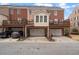 Townhome with multi car garages and outdoor living space on the upper level at 4305 Kendall Way, Roswell, GA 30075