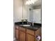 This bathroom has a modern vanity with granite countertop, stylish mirror, and upgraded fixtures at 449 Clairemont Ave # E1, Decatur, GA 30030
