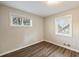An empty bedroom with light walls, hardwood floors, and two windows at 449 Clairemont Ave # E1, Decatur, GA 30030