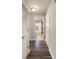 Hallway leading to bathroom, featuring a linen closet and hardwood floors at 449 Clairemont Ave # E1, Decatur, GA 30030