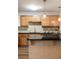 Charming kitchen with a breakfast bar, granite countertops, and ample cabinet space at 449 Clairemont Ave # E1, Decatur, GA 30030