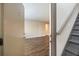 A view from the front door to the living room with wood flooring and stairs to a second story at 449 Clairemont Ave # E1, Decatur, GA 30030