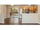 Living room with hardwood floors, stainless steel appliances, and sliding glass door to the deck at 449 Clairemont Ave # E1, Decatur, GA 30030