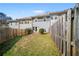 Fenced backyard with lawn at 1094 N Village Dr, Decatur, GA 30032