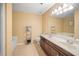 Large bathroom with double sink vanity, large mirror, and a separate soaking tub at 1094 N Village Dr, Decatur, GA 30032