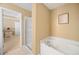 Beautiful bathroom featuring a jacuzzi tub and glass door shower at 1094 N Village Dr, Decatur, GA 30032