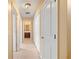 Hallway with white closet doors and a view into the bathroom at 1094 N Village Dr, Decatur, GA 30032