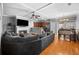 Open concept living room with fireplace and hardwood floors, flowing into the dining area at 1094 N Village Dr, Decatur, GA 30032