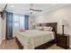 Bedroom featuring a wooden bed frame, wood flooring, a ceiling fan, and curtains at 215 Piedmont Ave # Apt 2104, Atlanta, GA 30308