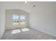 Carpeted bedroom featuring natural light from two windows at 226 Linford Dr, Locust Grove, GA 30248