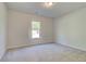 Carpeted bedroom with natural light from a window at 226 Linford Dr, Locust Grove, GA 30248