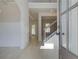 Bright and airy foyer features beautiful flooring, wainscoting, and a staircase with wrought iron spindles at 226 Linford Dr, Locust Grove, GA 30248