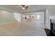 Open-concept living room with wood-look floors, kitchen, and a fireplace at 226 Linford Dr, Locust Grove, GA 30248