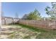 Fenced backyard with a combination of green grass and brown spots, surrounded by a tall wooden fence for privacy at 2650 Richfield Pl, Cumming, GA 30040