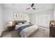 Inviting bedroom with tray ceiling, ceiling fan, and bright french doors at 50 Biscayne Nw Dr # 2111, Atlanta, GA 30309