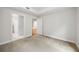 An empty bedroom features light gray walls and carpeting with an open ensuite bathroom at 50 Biscayne Nw Dr # 2111, Atlanta, GA 30309