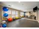 Bright gym with exercise balls, full-length mirrors, and natural light from the windows at 50 Biscayne Nw Dr # 2111, Atlanta, GA 30309