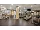 Well-equipped gym featuring modern exercise machines, mirrors, and ample natural light from the windows at 50 Biscayne Nw Dr # 2111, Atlanta, GA 30309