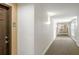 A hallway with unit door and a long carpet at 50 Biscayne Nw Dr # 2111, Atlanta, GA 30309