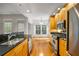 Well-lit kitchen featuring stainless steel appliances and wooden cabinetry at 50 Biscayne Nw Dr # 2111, Atlanta, GA 30309