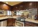 Granite countertops and stainless appliances highlight the kitchen with a bar overlooking living space at 5284 Vernon Springs Trl, Sandy Springs, GA 30327