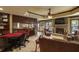 Spacious basement featuring a bar, stone fireplace, and comfortable seating area for entertainment at 5284 Vernon Springs Trl, Sandy Springs, GA 30327