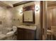 Elegant bathroom with a vanity, walk-in shower, and adjacent sauna for relaxation at 5284 Vernon Springs Trl, Sandy Springs, GA 30327