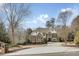 Charming two-story brick home featuring a well-manicured front yard and a spacious circular driveway at 5284 Vernon Springs Trl, Sandy Springs, GA 30327