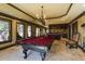 Game room featuring a pool table, seating, and access to the bar and kitchen area at 5284 Vernon Springs Trl, Sandy Springs, GA 30327