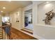 Hallway with hardwood floors and trim carpentry, with an open view to a living area at 5284 Vernon Springs Trl, Sandy Springs, GA 30327