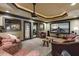 Comfortable home theater room with plush seating, large screen, and custom lighting at 5284 Vernon Springs Trl, Sandy Springs, GA 30327