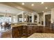 Gourmet kitchen featuring a center island with seating, stone countertops, and wood cabinets at 5284 Vernon Springs Trl, Sandy Springs, GA 30327