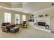 Living room featuring a fireplace with large windows for natural light at 5284 Vernon Springs Trl, Sandy Springs, GA 30327