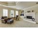 Relaxing sitting room featuring a fireplace, large windows, and built in storage at 5284 Vernon Springs Trl, Sandy Springs, GA 30327
