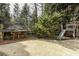 Backyard play area with playhouse, slide, and swing set provides entertainment at 5284 Vernon Springs Trl, Sandy Springs, GA 30327