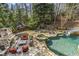 Relax in this outdoor pool with an attached waterslide at 5284 Vernon Springs Trl, Sandy Springs, GA 30327