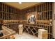 Impressive wine cellar featuring custom shelving, temperature control, and ample storage at 5284 Vernon Springs Trl, Sandy Springs, GA 30327