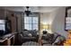 Cozy living room with ceiling fan, neutral walls, and comfortable seating arrangement at 10143 Settlers Grove Ne Rd, Covington, GA 30014