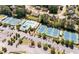 Aerial view showcasing the community clubhouse, pool, tennis courts, and parking area in a neighborhood setting at 426 Highcrest Dr, Acworth, GA 30101