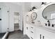 Bright bathroom featuring a double vanity with white countertops, black hardware, and a glass enclosed tiled shower at 426 Highcrest Dr, Acworth, GA 30101