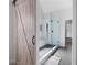 Modern bathroom featuring a frameless glass shower with white subway tile, black hardware and a light wood sliding door at 426 Highcrest Dr, Acworth, GA 30101