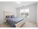 Bedroom with neutral carpet, a white bed, a window, and light colored walls at 426 Highcrest Dr, Acworth, GA 30101