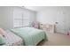 Bright bedroom with a large window, plush chair, and a stylish storage unit at 426 Highcrest Dr, Acworth, GA 30101