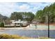 Community center with a shaded playground, basketball court and ample parking nestled among mature trees at 426 Highcrest Dr, Acworth, GA 30101